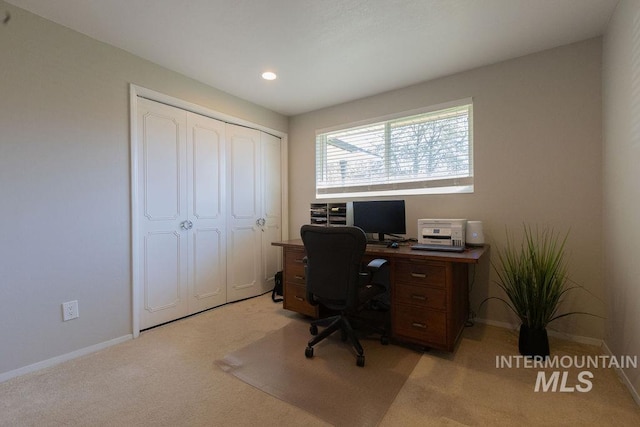 office area with baseboards, recessed lighting, and light carpet