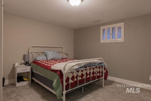 carpeted bedroom with baseboards