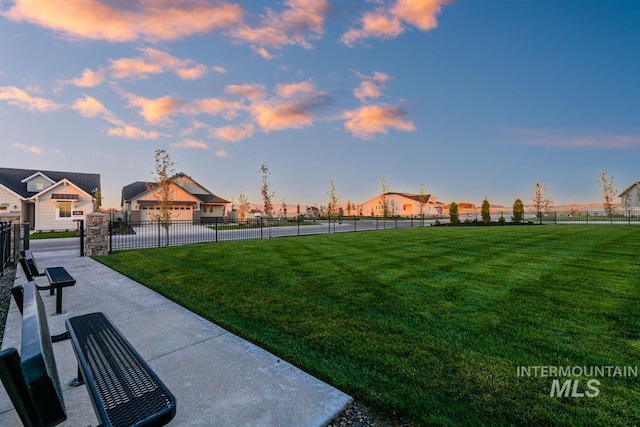 view of property's community with a yard