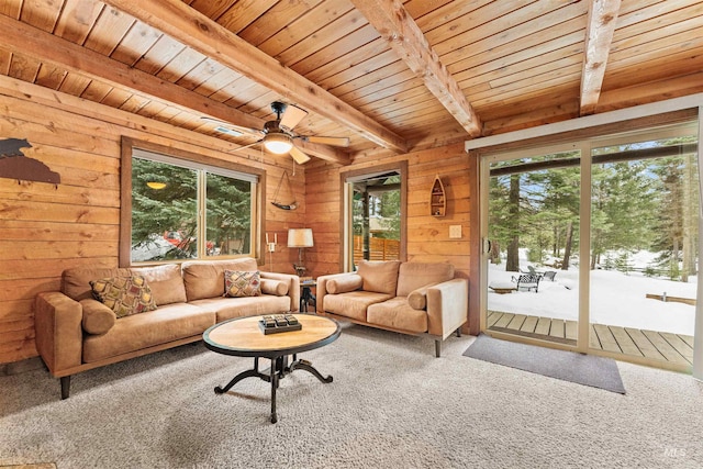 living room featuring wood walls, ceiling fan, beam ceiling, and wood ceiling