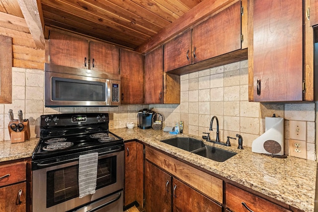 kitchen with decorative backsplash, appliances with stainless steel finishes, light stone countertops, wood ceiling, and sink