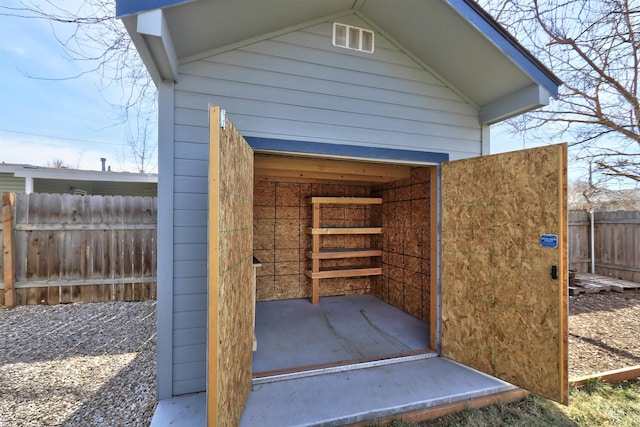 view of outbuilding with an outdoor structure and fence