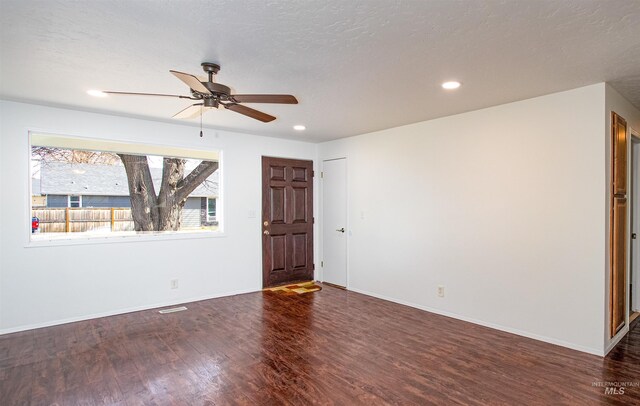 interior space with recessed lighting, ceiling fan, baseboards, and wood finished floors