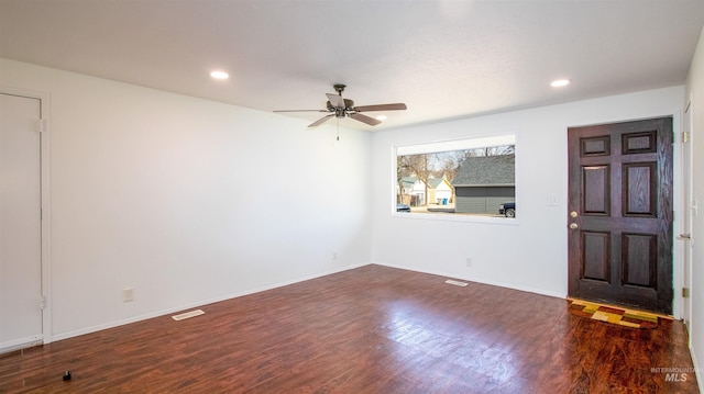 empty room featuring visible vents, baseboards, recessed lighting, wood finished floors, and a ceiling fan