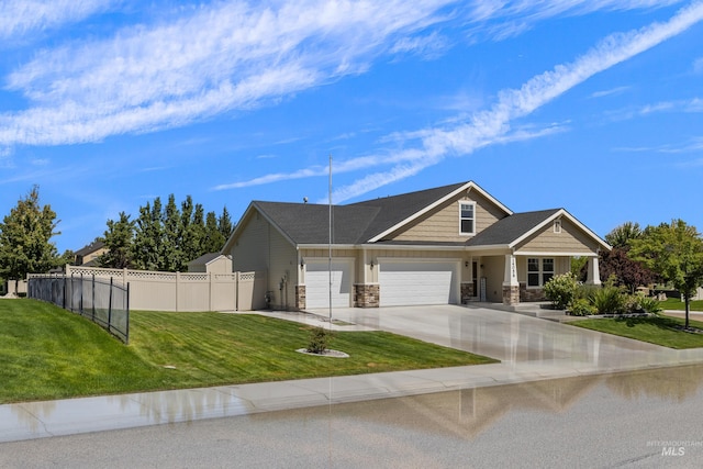 view of front of home featuring a front yard and a garage