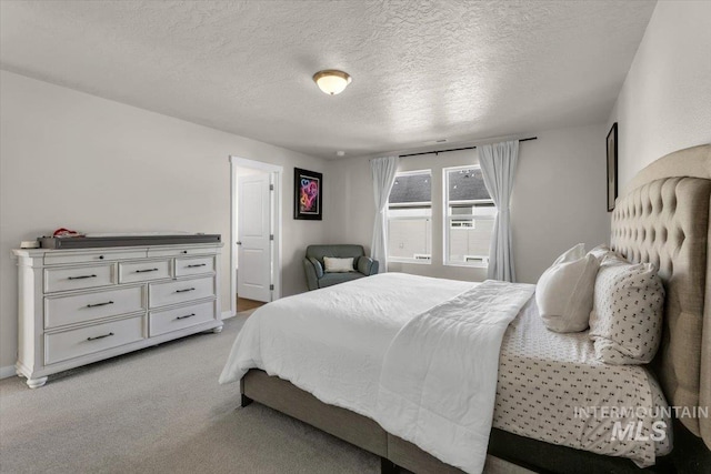 1266 S Wiston Ave, Kuna, ID 83634 - bedroom featuring light colored carpet and a textured ceiling