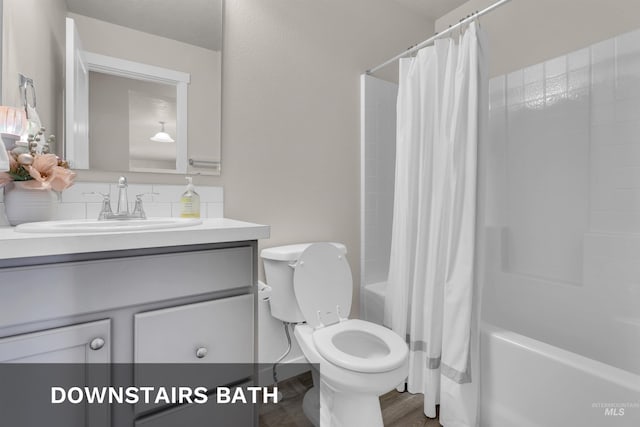 1266 S Wiston Ave, Kuna, ID 83634 - full bathroom with vanity, shower / tub combo, wood finished floors, and toilet