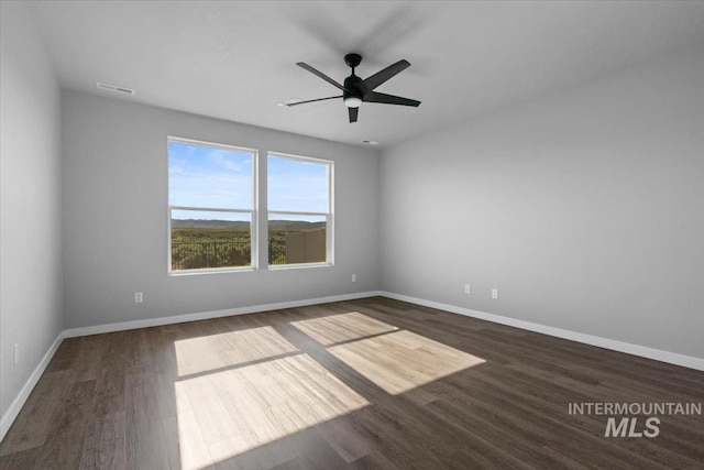 8450 S Bogus Ridge Ave, Boise, ID 83716 - empty room featuring baseboards, wood finished floors, and ceiling fan