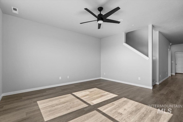 8450 S Bogus Ridge Ave, Boise, ID 83716 - unfurnished room featuring wood finished floors, baseboards, and ceiling fan