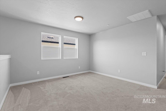 8450 S Bogus Ridge Ave, Boise, ID 83716 - unfurnished room featuring carpet, baseboards, and a textured ceiling