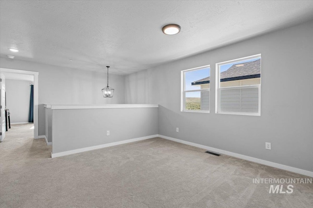 8450 S Bogus Ridge Ave, Boise, ID 83716 - unfurnished room featuring carpet flooring, a textured ceiling, and baseboards