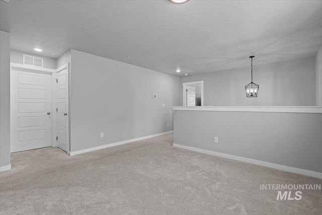 8450 S Bogus Ridge Ave, Boise, ID 83716 - carpeted spare room featuring baseboards, recessed lighting, and a chandelier