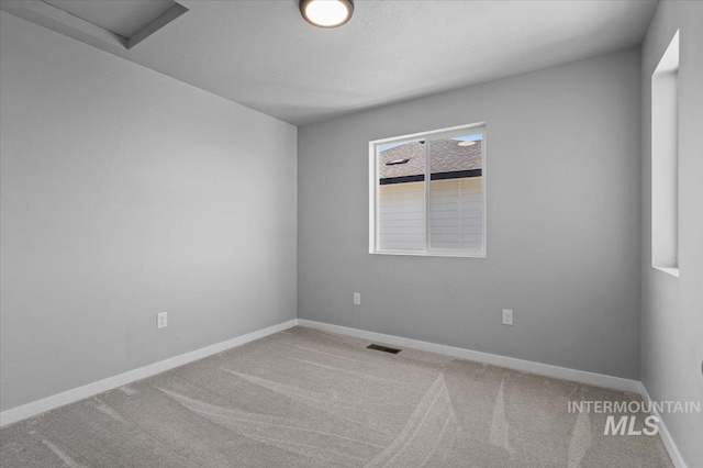 8450 S Bogus Ridge Ave, Boise, ID 83716 - carpeted empty room with attic access and baseboards