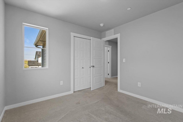 8450 S Bogus Ridge Ave, Boise, ID 83716 - unfurnished bedroom with carpet floors, baseboards, and a closet