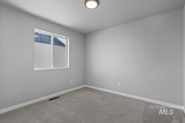 8450 S Bogus Ridge Ave, Boise, ID 83716 - spare room featuring carpet and baseboards