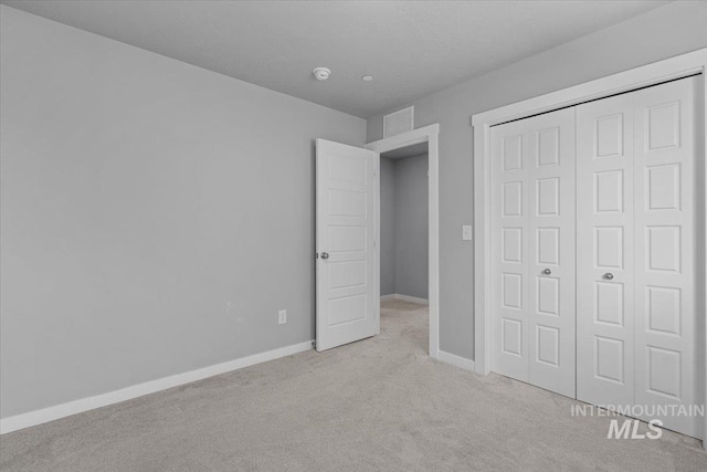 8450 S Bogus Ridge Ave, Boise, ID 83716 - unfurnished bedroom featuring carpet flooring, a closet, and baseboards