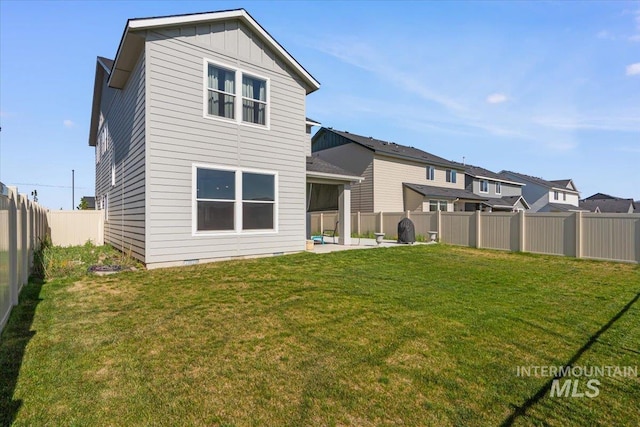 8450 S Bogus Ridge Ave, Boise, ID 83716 - rear view of property with a patio and board and batten siding