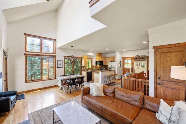 23 Golden Bar Ct, Donnelly, ID 83615 - living area with light wood-type flooring, recessed lighting, and a towering ceiling