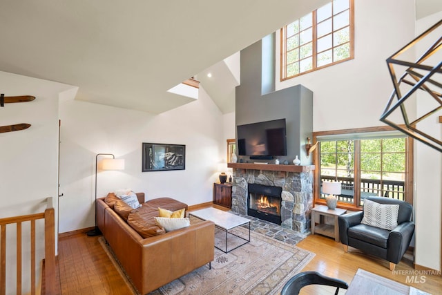 23 Golden Bar Ct, Donnelly, ID 83615 - living room with hardwood / wood-style floors, a fireplace, and high vaulted ceiling