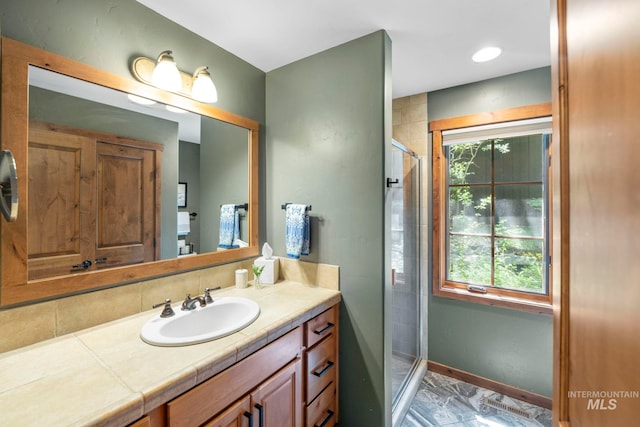 23 Golden Bar Ct, Donnelly, ID 83615 - bathroom featuring vanity, a stall shower, and marble look tile flooring