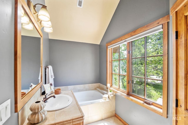 23 Golden Bar Ct, Donnelly, ID 83615 - bathroom with a garden tub, lofted ceiling, vanity, and tile patterned floors