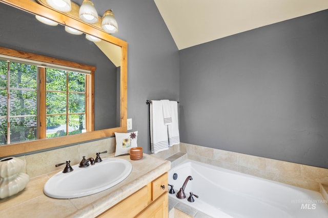 23 Golden Bar Ct, Donnelly, ID 83615 - bathroom with vanity, a bath, and lofted ceiling