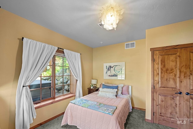 23 Golden Bar Ct, Donnelly, ID 83615 - bedroom with carpet floors and a chandelier