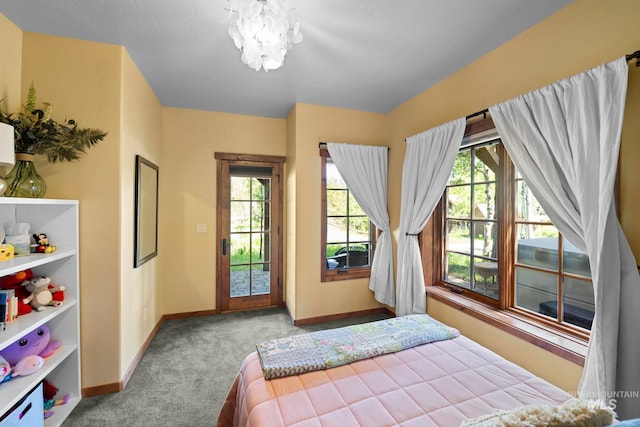 23 Golden Bar Ct, Donnelly, ID 83615 - carpeted bedroom featuring access to outside and a chandelier