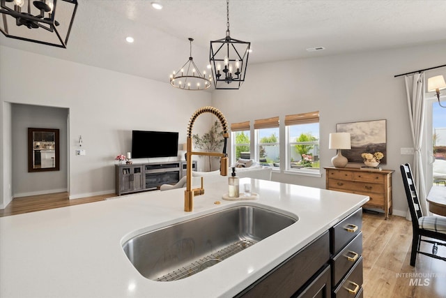 2188 Navigator St, Middleton, ID 83644 - kitchen with a chandelier, open floor plan, light countertops, decorative light fixtures, and recessed lighting