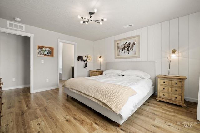 2188 Navigator St, Middleton, ID 83644 - bedroom with a chandelier and wood finished floors