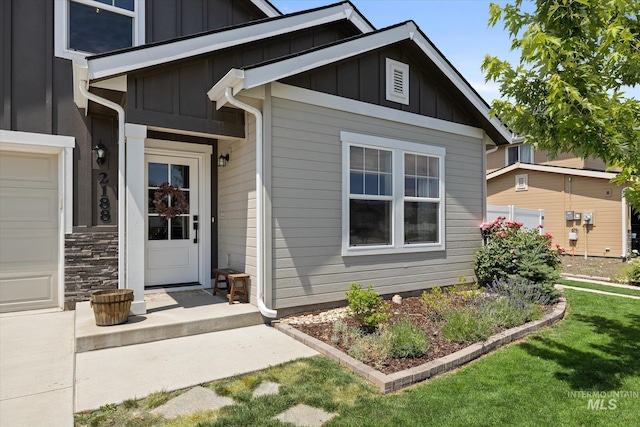 2188 Navigator St, Middleton, ID 83644 - view of exterior entry featuring board and batten siding and a lawn