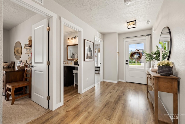 2188 Navigator St, Middleton, ID 83644 - entrance foyer with a textured ceiling and light wood-style floors