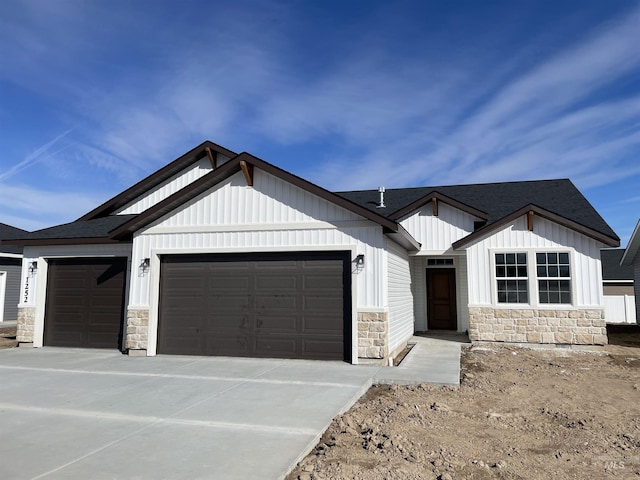 modern inspired farmhouse with driveway, board and batten siding, an attached garage, and a shingled roof