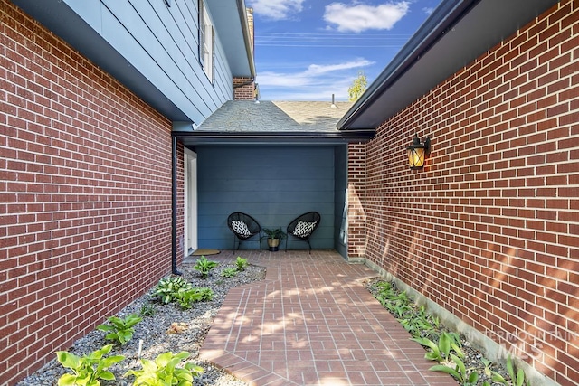 view of side of property with brick siding