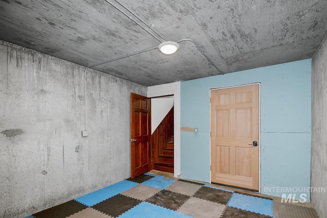 spare room featuring stairs