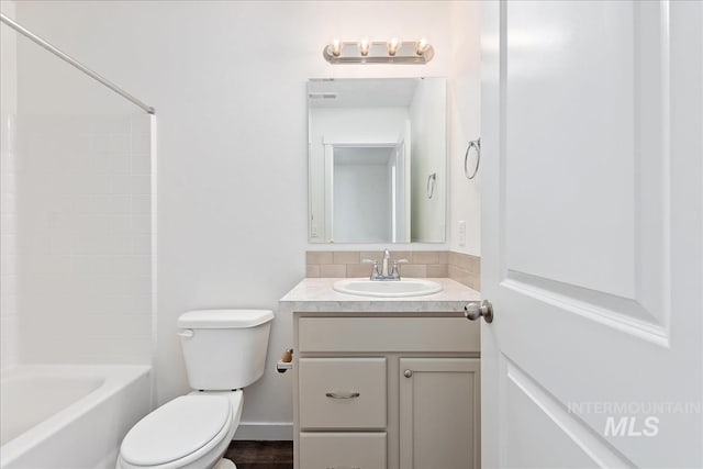 full bathroom with vanity, shower / bathtub combination, and toilet