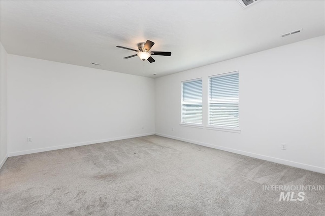 empty room featuring light carpet and ceiling fan