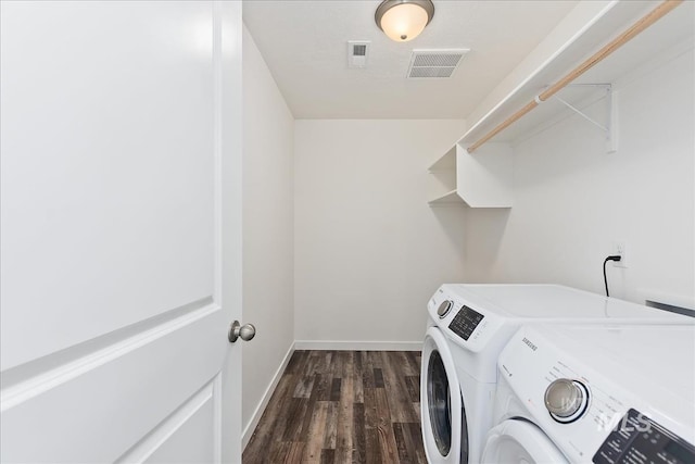 laundry room featuring dark hardwood / wood-style floors and independent washer and dryer