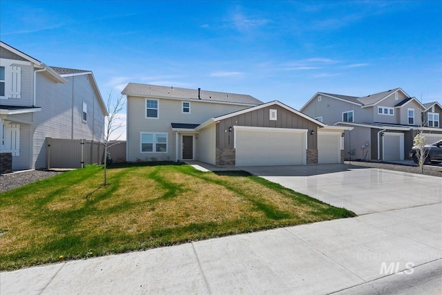 view of front of house with a front yard and a garage