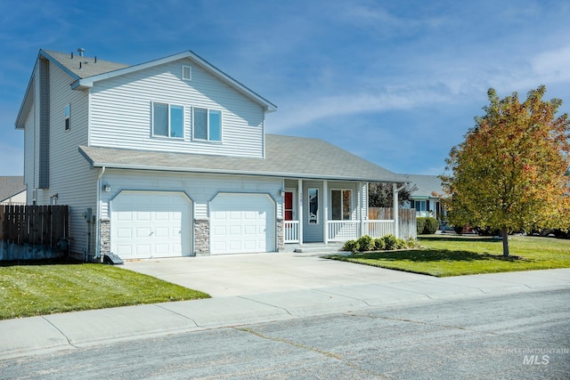 view of front facade featuring a porch, a garage, and a front yard