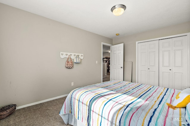 bedroom featuring a closet, baseboards, and carpet floors