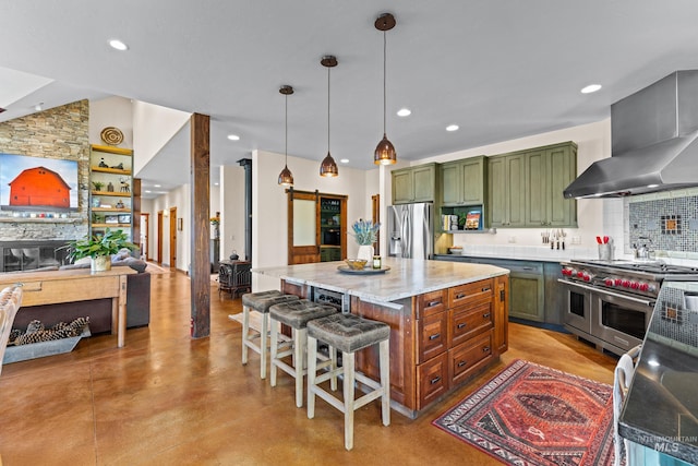 306 Otter Pond Ln, Mccall, ID 83638 - kitchen featuring appliances with stainless steel finishes, green cabinetry, recessed lighting, and wall chimney exhaust hood