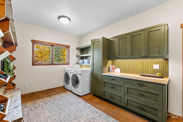 306 Otter Pond Ln, Mccall, ID 83638 - laundry area featuring baseboards, cabinet space, and independent washer and dryer