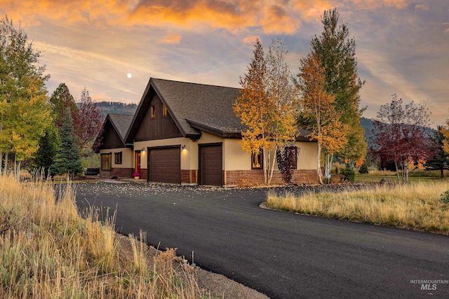 306 Otter Pond Ln, Mccall, ID 83638 - view of front of house featuring roof with shingles and an attached garage