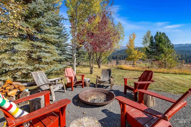 306 Otter Pond Ln, Mccall, ID 83638 - view of patio featuring an outdoor fire pit and a mountain view