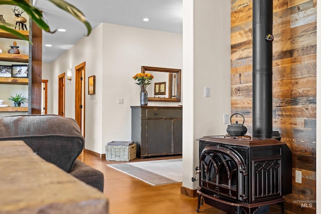 306 Otter Pond Ln, Mccall, ID 83638 - interior space with concrete flooring, baseboards, a wood stove, and recessed lighting