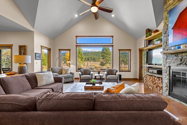 306 Otter Pond Ln, Mccall, ID 83638 - living room featuring a ceiling fan, high vaulted ceiling, recessed lighting, and a stone fireplace