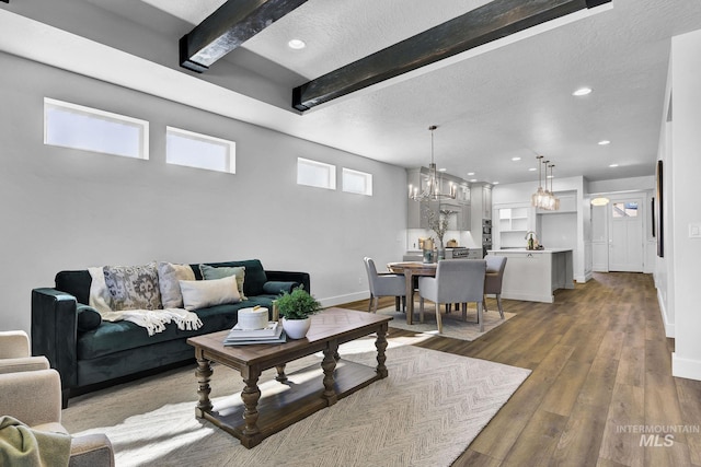6318 S Utmost Ln, Meridian, ID 83642 - living room with beam ceiling, a textured ceiling, wood finished floors, recessed lighting, and a chandelier