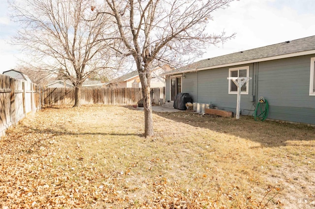 view of yard with a fenced backyard