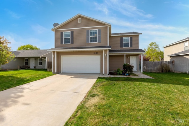 traditional-style house featuring a front lawn, driveway, an attached garage, and fence